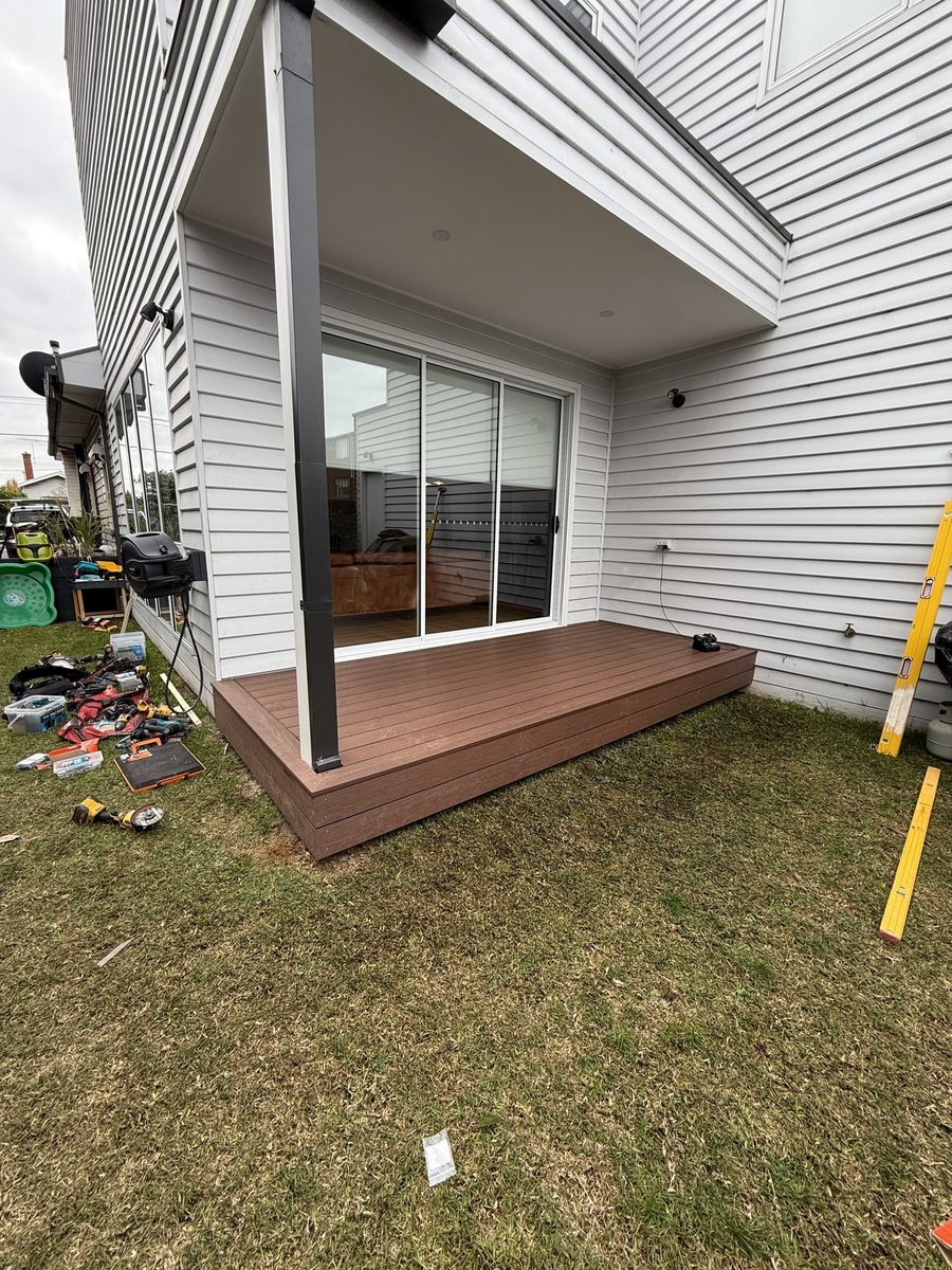 A modest deck on an ordinary house